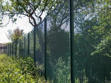Tall welded mesh fence with steel posts